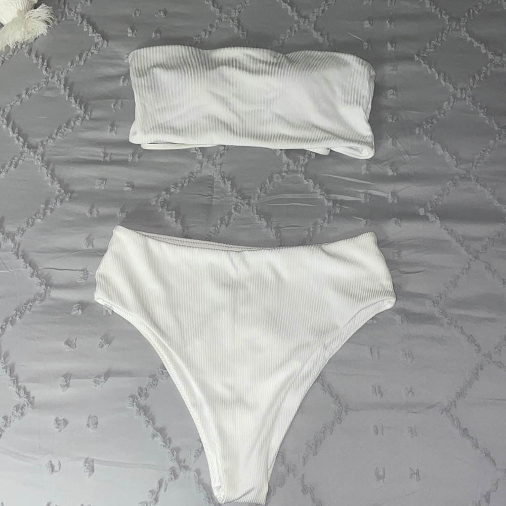 White strapless bikini. Small but fits as a medium.